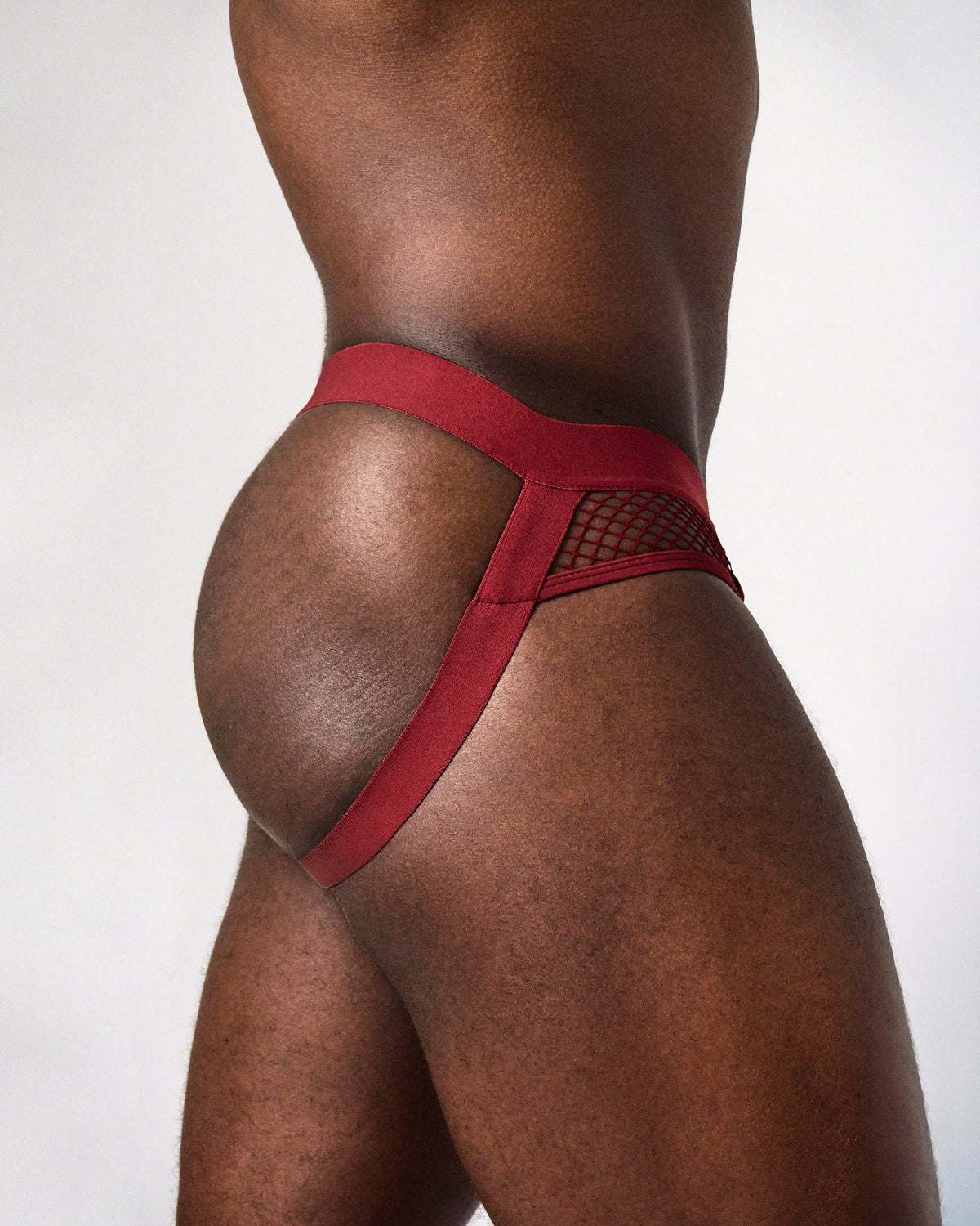 Edge Net Jock/Thong in Maroon, side close-up of the net side panel and leg strap