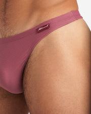Closeup shot of Eclipse Thong in cranberry color